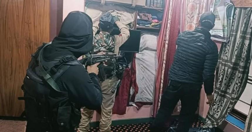 Cops of J&K Police conducting search at the residence of terror associate in Srinagar Cops