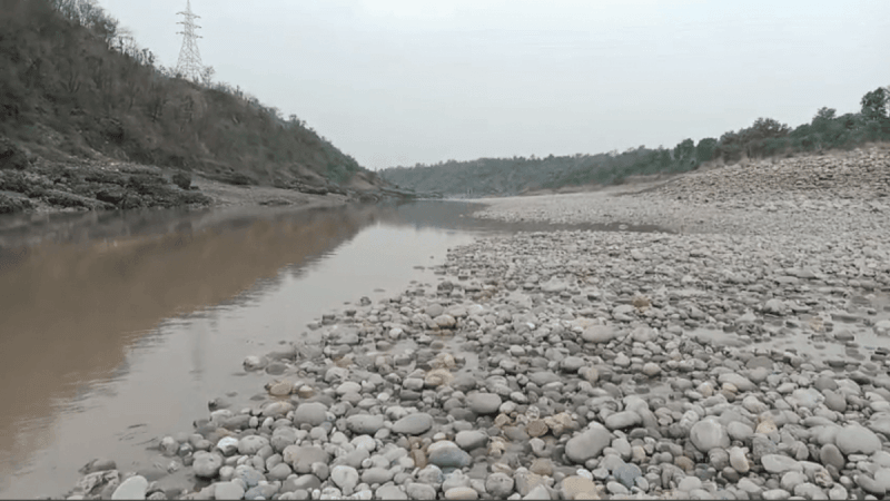 A view of the river Chenab running dry beyond Akhnoor bridge of Jammu district River Chenab