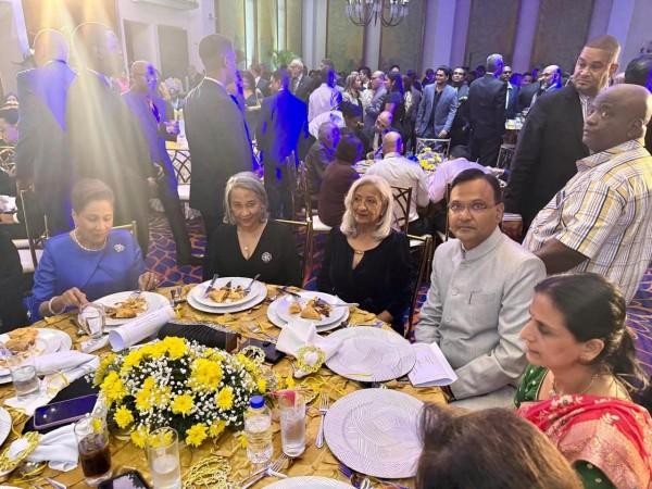 Indian High Commissioner Dr. Pradeep Singh Rajpurohit, Accompanied by His Wife, Attends Victory Celebration Dinner with Trinidad & Tobago Prime Minister Kamla Persad-Bissessar Seen in Photo  PM Kamla Persad  Dr Pradeep singh Rajpurohit his wife and others
