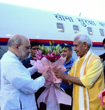 Jammu and Kashmir Lieutenant Governor Manoj Sinha receiving Union Home Minister Amit Shah at Jammu Amit Shah
