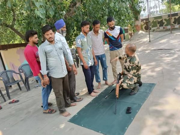 Troopers of the BSF imparting arms training to Village Defence Guards of border areas of Jammu BSF