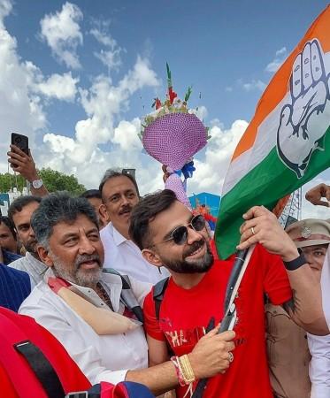 RCB team gets grand welcome at B'luru airport, Shivakumar gifts Kannada flag to Virat Kohli RCB team gets grand welcome at B'luru airport, Shivakumar gifts Kannada flag to Virat Kohli