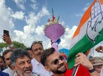 RCB team gets grand welcome at B'luru airport, Shivakumar gifts Kannada flag to Virat Kohli