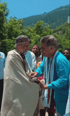 BJP leader Ravinder Raina felicitating National Conference senior leader and Lok Sabha member Mian Altaf in central Kashmir's Kangan area Mian Altaf and Ravinder Raina