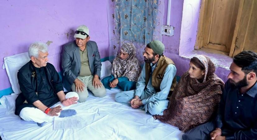 Lieutenant Governor of J&K Manoj Sinha interacting with family members of Adil Shah, a ponnywalla who lost his life in Pahalgam terror attack Manoj Sinha