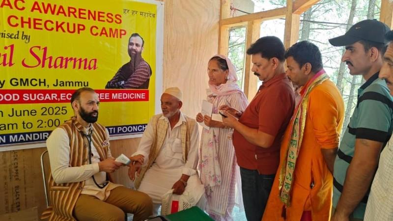 Dr. Sushil Sharma, Head of Cardiology at GMC Jammu, checking patients during a led health camp near the Line of Control in Poonch district. Dr Sushil Sharma