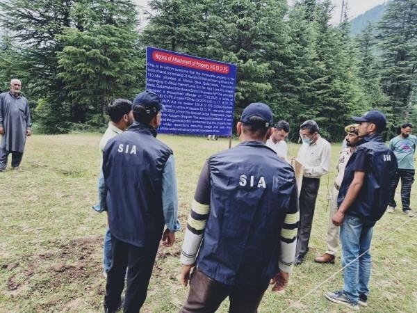 Sleuths of State Investigation Agency of J&K Police attaching property of a Pakistan-based terrorist State Investigation Agency