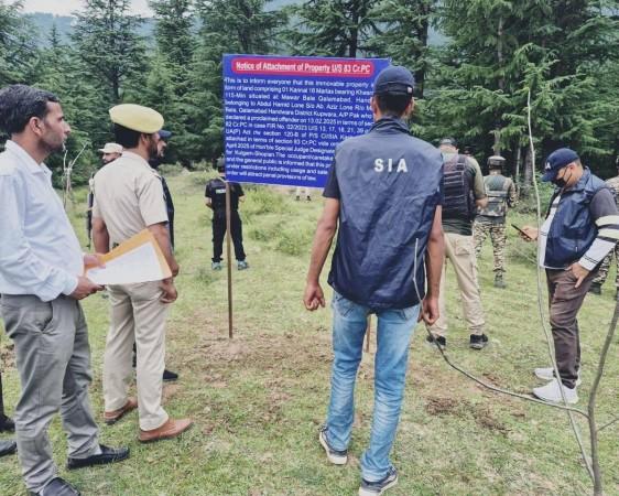 Sleuths of State Investigation Agency of J&K Police attaching property of a Pakistan-based terrorist State Investigation Agency