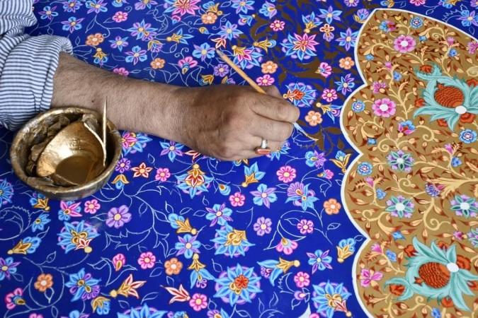 Naqashi in motion.Photo/Midhat. Paper Mache.