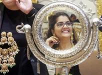 Gold prices slip after US Fed signals more gradual path for rate cuts