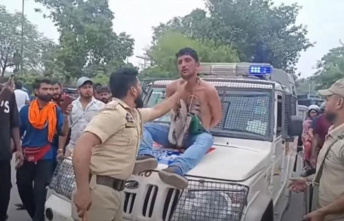 An alleged thief was paraded semi-naked in Jammu by cops and locals. Alleged thief