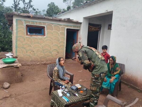 An Army doctor examining a patient in a remote village of Rajouri Medical camp