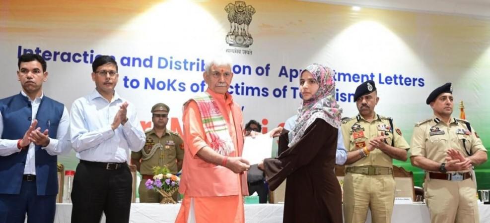 Lieutenant Governor of J&K Manoj Sinha handing over appointment letters to terror victim families of Baramulla district LG Manoj