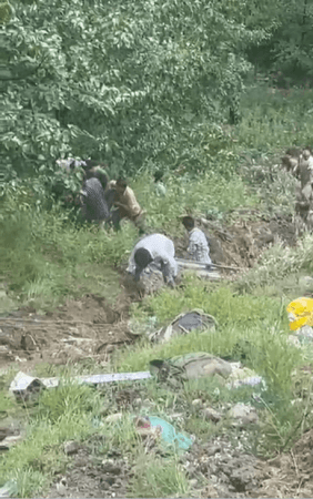 Locals rescuing injured after a vehicle skidded off the road and fell into a deep gorge in J&K's Doda district Doda accident