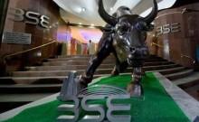 Sensex, Nifty trade flat after mild early losses; realty stocks gain