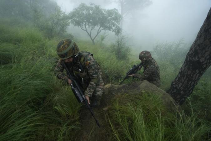 Soldiers conducting search on LoC Soldier on LoC