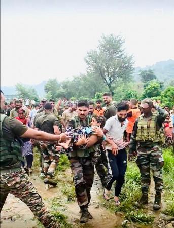 Soldiers of the Indian Army rescuing a child in Kathua Kathua floods