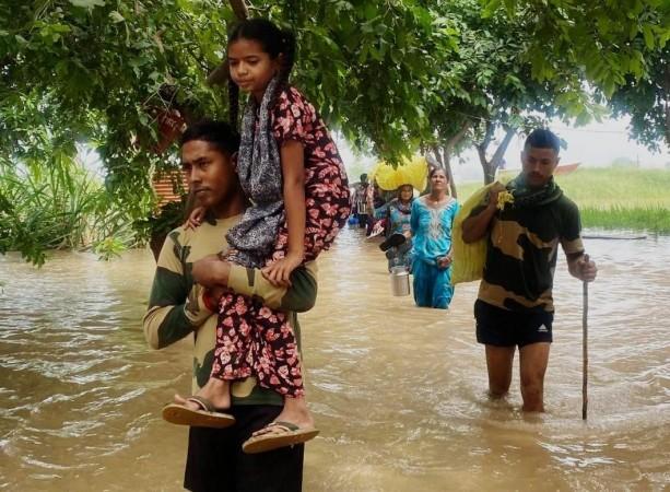 Punjab flood: Thousands spend night on rooftops; await relief material Punjab flood: Thousands spend night on rooftops; await relief material