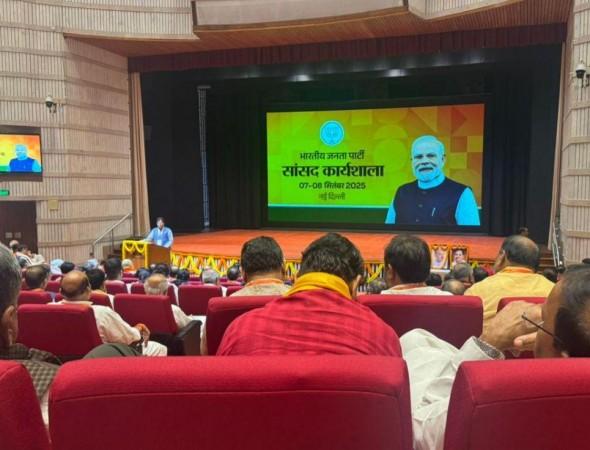 PM Modi sits in last row among BJP MPs during party workshop PM Modi sits in last row among BJP MPs during party workshop