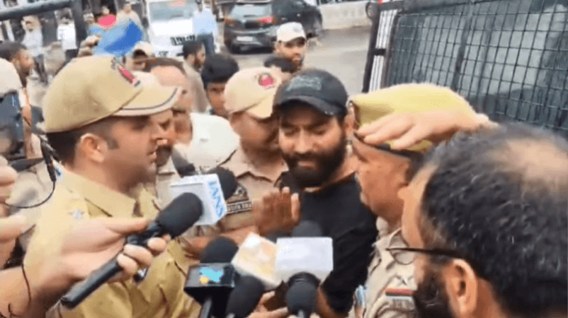 The only AAP MLA in Jammu and Kashmir Mehraj Din Malik being detained by cops after slapping PSA on him. Mehraj Malik