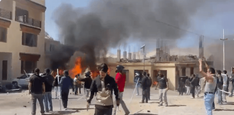A view of BJP office set on fire by protesters in Leh BJP office