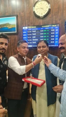 BJP leaders offering sweets to Sat Pal Sharma who is nominated as party candidate for Rajya Sabha election Sat Pal Sharma