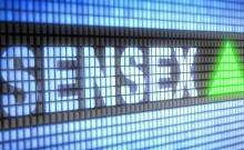 Sensex, Nifty end lower amid volatile trade