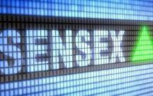 Sensex, Nifty end lower amid volatile trade