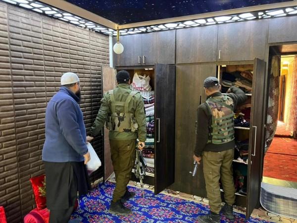 Cops searching house of a sympathizer of Jamaat-e-Islami in south Kashmir's Anantnag district J&K Police