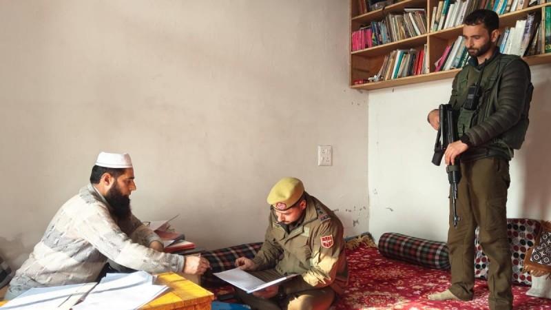 Cops searching record at a Madrass in Srinagar J&K Police