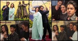 SRK comforts Yug as he appears nervous; Nysa beams with Joy as SRK–Kajol pose after unveiling bronze statue at London's Leicester Square