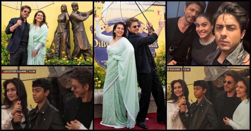 SRK comforts Yug as he appears nervous; Nysa beams with Joy as SRK–Kajol pose after unveiling bronze statue at London's Leicester Square