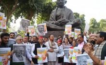 Raising slogans such as