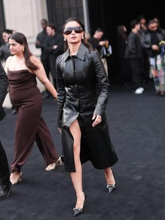 Alia Bhatt serves fashion goals in a shimmering black leather car coat featuring a tailored silhouette Alia Bhatt serves fashion goals in a shimmering black leather car coat featuring a tailored silhouette