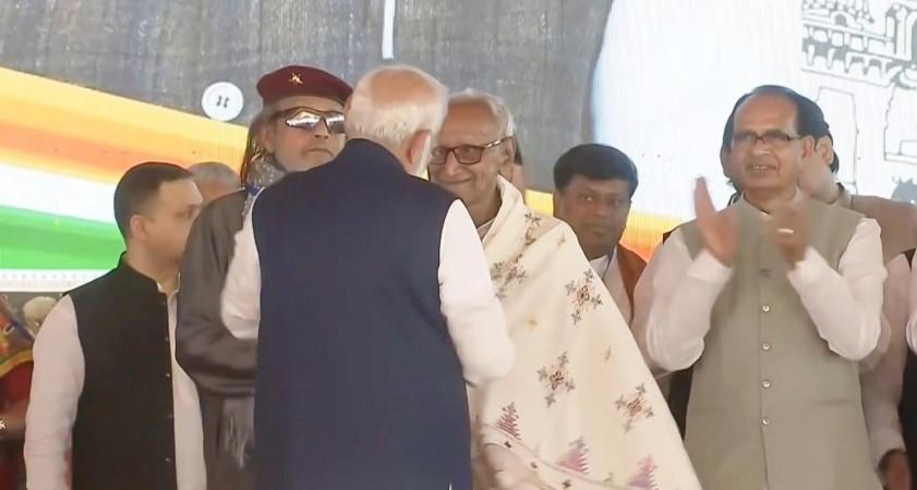 Suvendu Adhikari sworn in as Bengal's first BJP CM; PM Modi touches feet of 97-year-old Makhan Lal Sarkar in Bengal