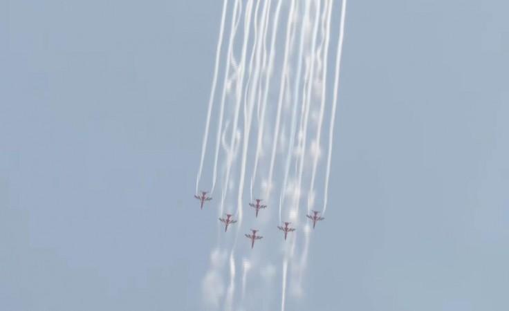IAF Suryakiran aerobatics, green smoke trails; Chetak's flower shower mark Somnath Amrut Mahotsav