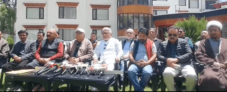 Ladakh Congress chief Asgar Ali Karbalai (middle) addressing a press conference at Kargil LAHDC