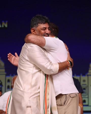PM Modi Congratulates DK Shivakumar; Rahul Gandhi and DK hold hands, hug each other; a look at Grand Oath Ceremony