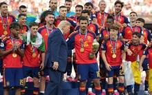 Donald Trump refuses to leave podium in awkward moment as Spain lift World Cup