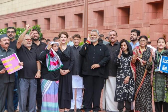 Oppn MPs in black protest outside Parliament House over NEET paper leak, police cruelty Oppn MPs in black protest outside Parliament House over NEET paper leak, police cruelty