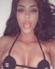 Kim Kardashian flaunts her curves in a Chanel bikini