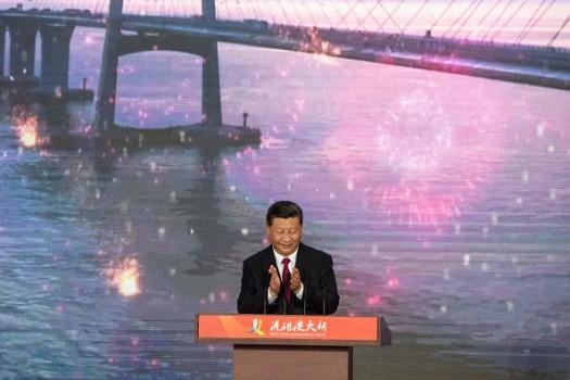 Chinese President Xi Jinping launches the world's longest sea-bridge