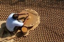 An Indian potter makes diyas (earthen lamps)