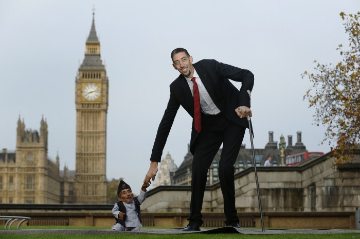 The world's shortest man Chandra Bahadur Dangi greets the tallest living man Sultan Kosen to mark the Guinness World Records Day in London Weird World Records,World Records,Guinness record,Guinness record 2014,Guinness record 2015,world records list,world records 2013,world records human body,amazing world records,world records dance,easy world records to break