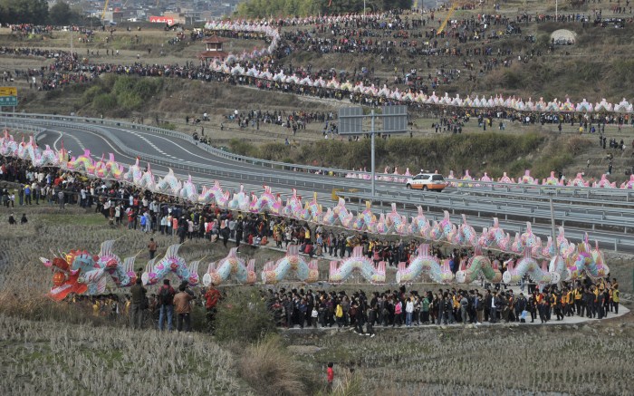 Villagers perform the annual dragon march to celebrate the Lantern Festival in Gutian township, Fujian province Weird World Records,World Records,Guinness record,Guinness record 2014,Guinness record 2015,world records list,world records 2013,world records human body,amazing world records,world records dance,easy world records to break