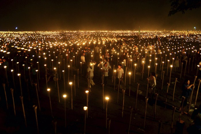 Volunteers light candles during the Light of Peace in the Philippines event in Oton town at Iloilo province, central Philippines Weird World Records,World Records,Guinness record,Guinness record 2014,Guinness record 2015,world records list,world records 2013,world records human body,amazing world records,world records dance,easy world records to break