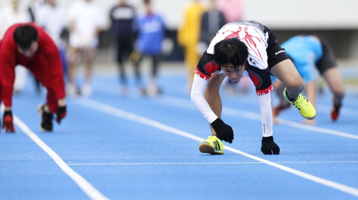 Takashi Kokubu, a 37-year-old actor, runs during a four-legged 100-metre race organized by Kenichi Ito (not pictured) in Tokyo Weird World Records,World Records,Guinness record,Guinness record 2014,Guinness record 2015,world records list,world records 2013,world records human body,amazing world records,world records dance,easy world records to break