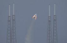 The unmanned SpaceX Crew Dragon lifts off from launch pad 40 during a Pad Abort Test at the Cape Canaveral Air Force Station in Cape Canaveral