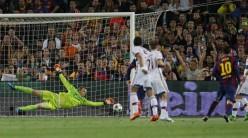 Barcelona's Lionel Messi scores their first goal past Bayern Munich's Manuel Neuer