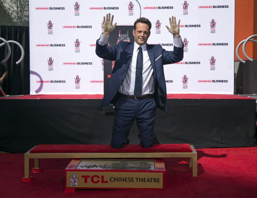 Vince Vaughn shows his hands after leaving handprints in cement (REUTERS) Vince Vaughn,handprints,footprints,TCL Chinese theatre,Hollywood,Jon Favreau,James Marsden,photos